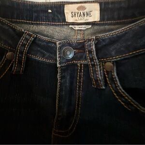 NWOT Shyanne jeans. Size 29. Dark blue wash with embroidered stitching.